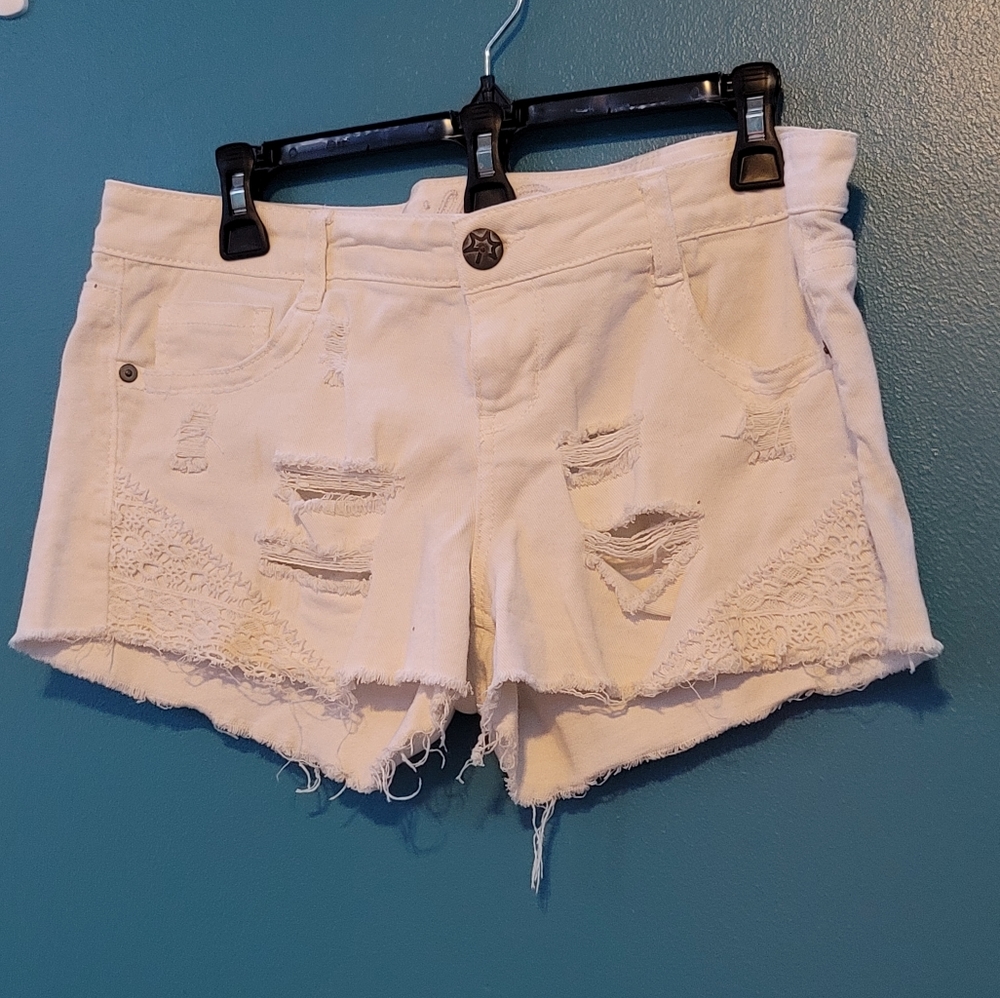 White ripped Jean shorts fits small to medium